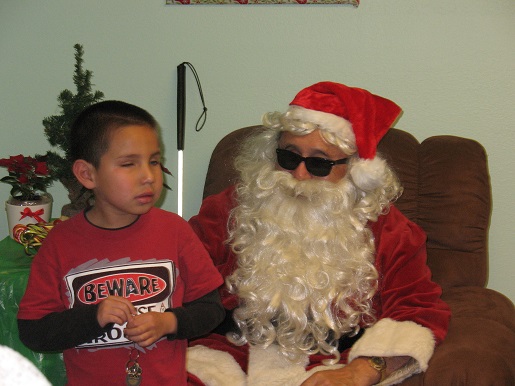A little boy and Blind Santa